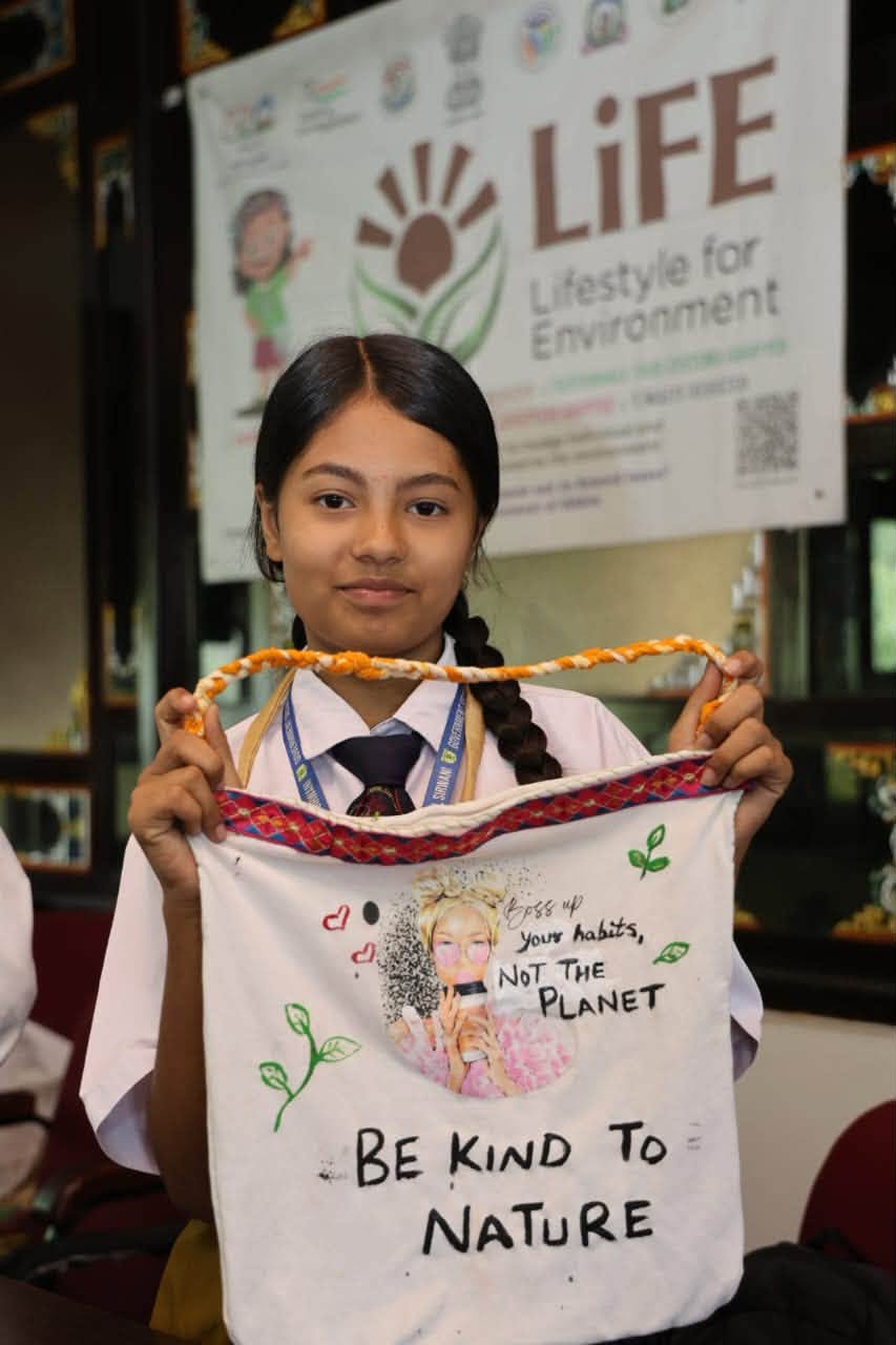 Student Presenting Eco Bag Artwork - Be Kind to Nature
